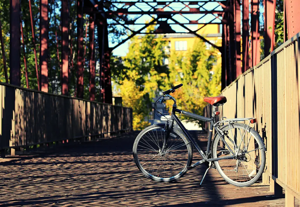 A bike parked on a bridge along the Boise River Greenbelt.