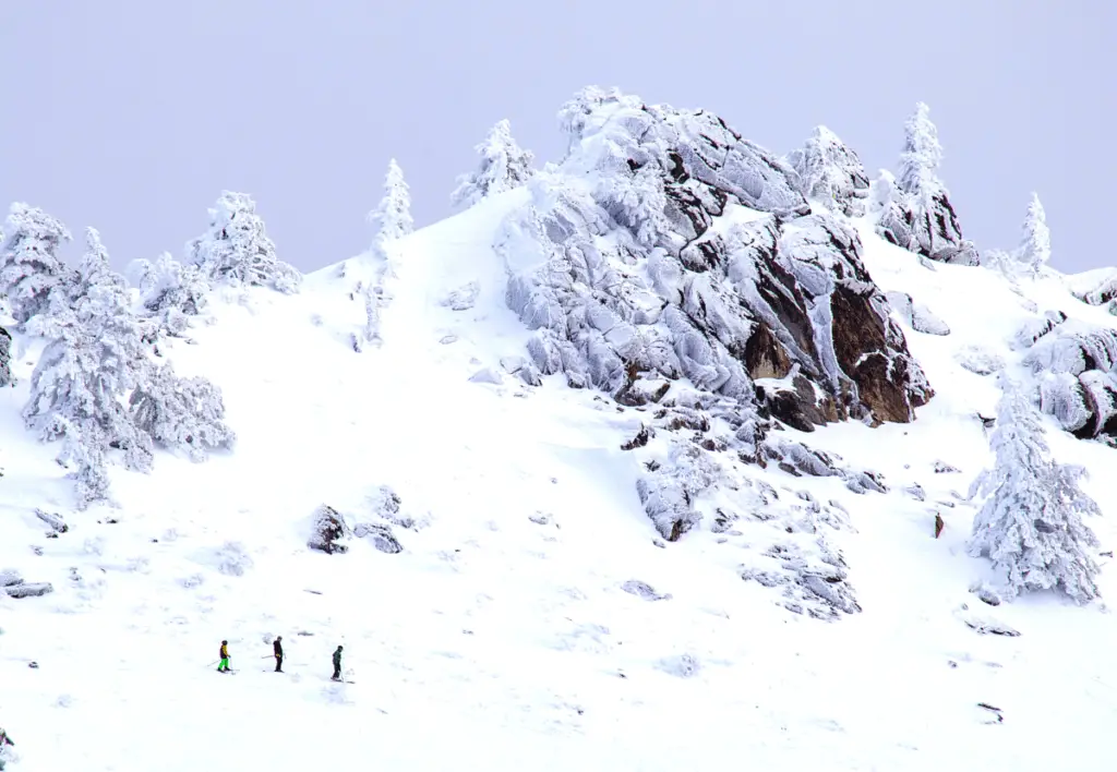 Skiers going down Bogus Basin hill in Idaho.