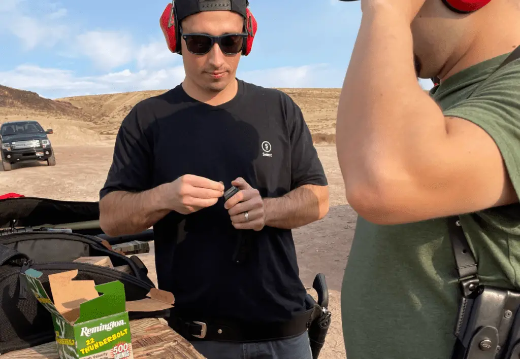 Loading a clip at a shooting range.