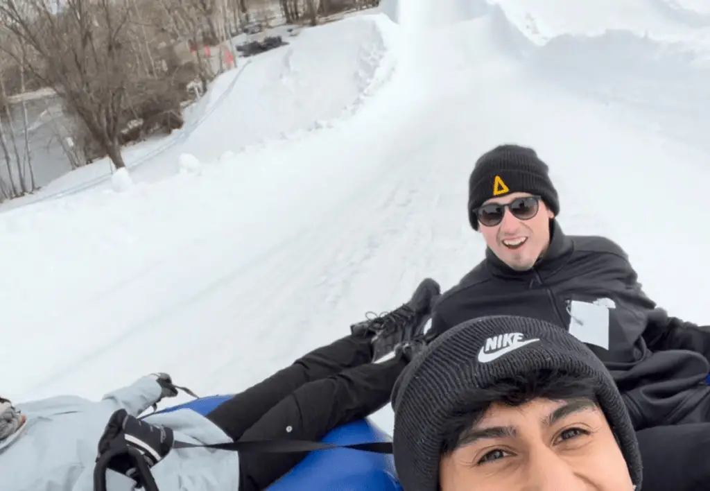 A picture of me and my brother-in-law snow tubing in Boise, Idaho.